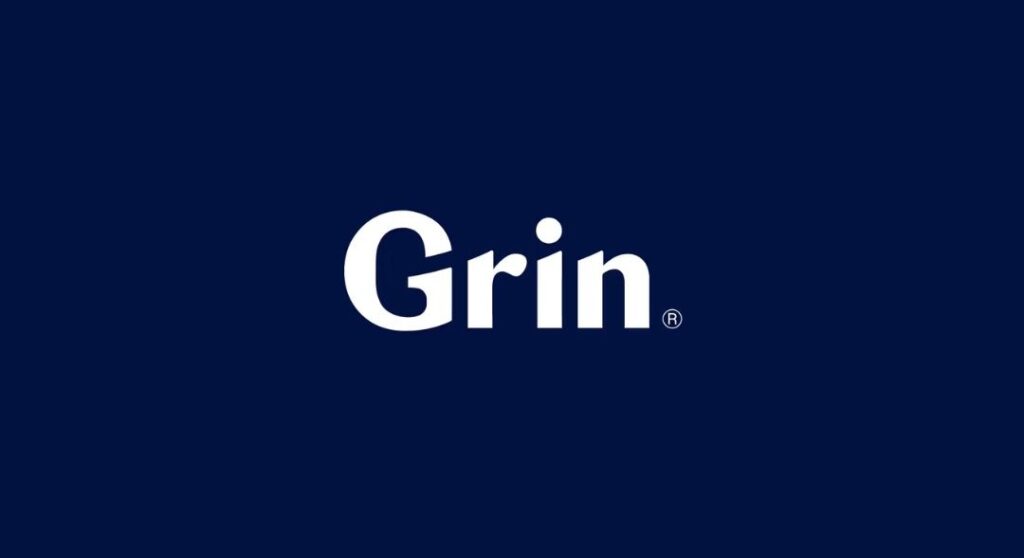 Grin logo on dark background | Dr. Doug Orthodontics